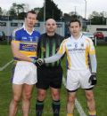 St.Mary's Rasharkin Captain Paul Doherty and St.Brigid's Captain Brian McMahon with referee Gary Brown (Con Magees Glenravel)